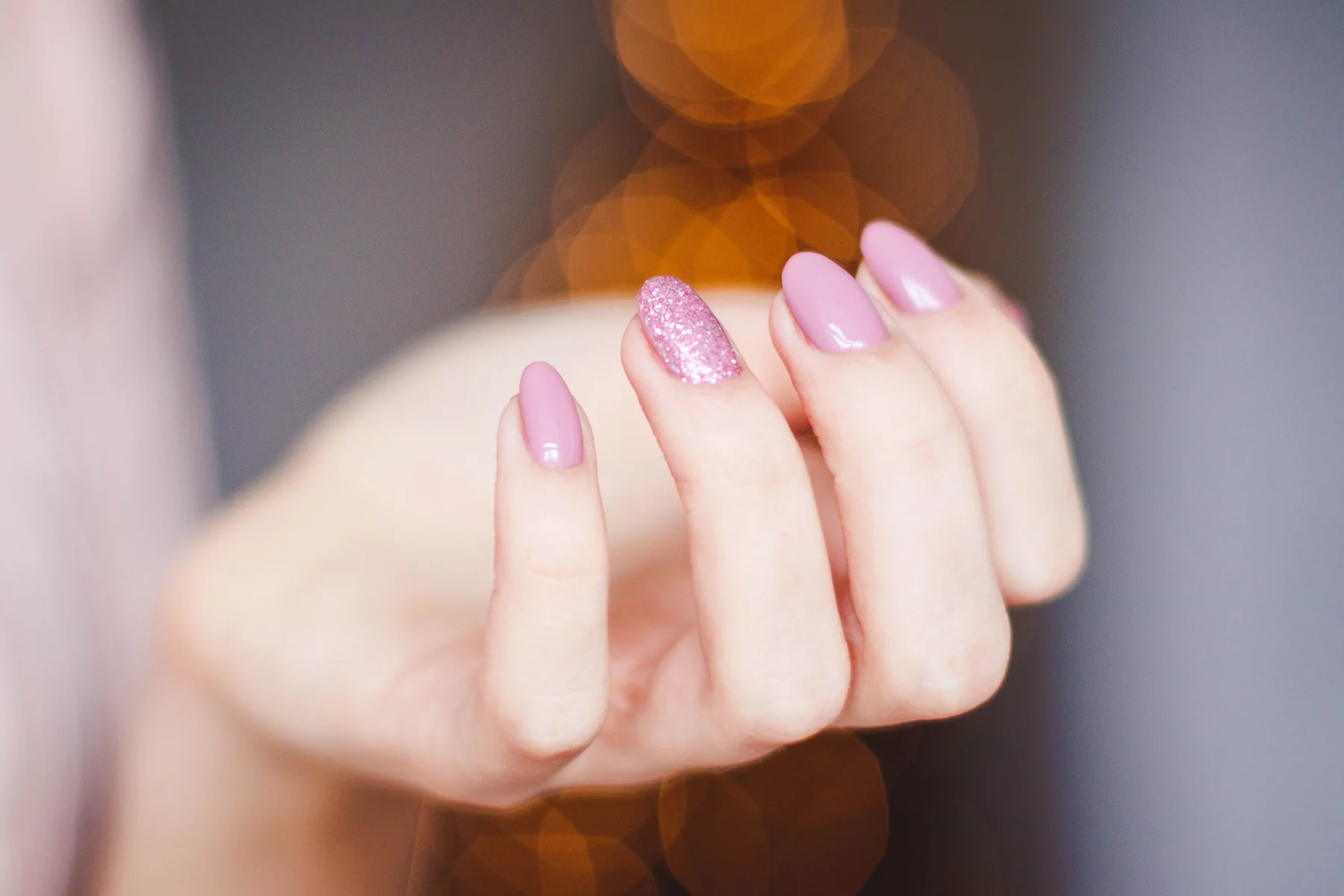 Pink manicure with a glitter accent nail